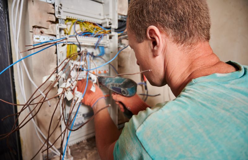 Electrician Working on a Panel